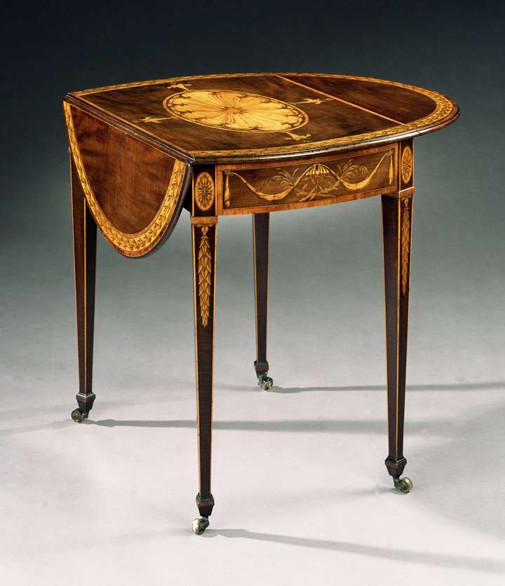 A GEORGE III HAREWOOD OVAL PEMBROKE TABLE